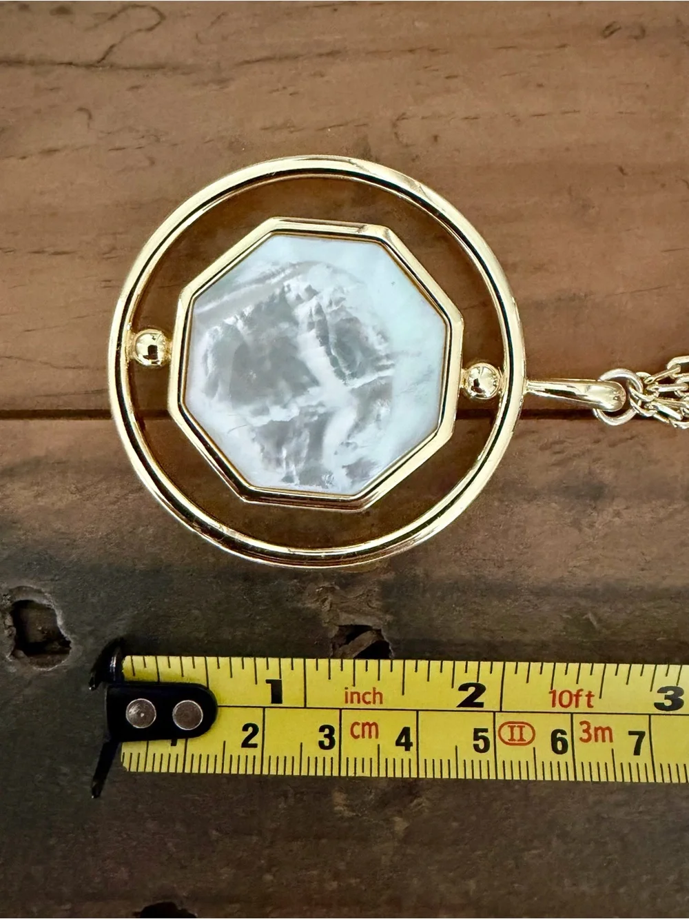 CONNIE CRAIG CARROLL “JONES GOLD-PLATED REVERSIBLE CABOCHON PENDANT NECKLACE